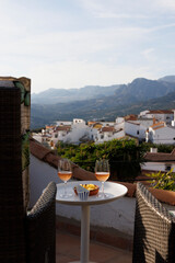 Lovely mountain view by relaxing chairs and two glasses of Rose