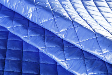 blue quilted jacket fabric, neatly folded