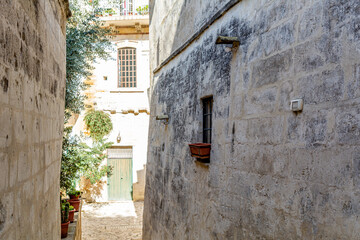 Narrow street in the historic City of Materia in southern Italy. Matera was in 2019 the European Capital of Culture