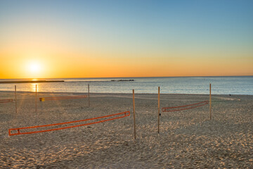 Fototapeta premium Barceloneta beach at sunrise in Barcelona. Spain
