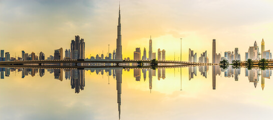 Skyline panorama of Dubai with reflection at sunset, UAE