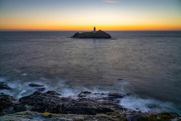 Godrevy lighthouse at sunset in Cornwall. United Kingdom