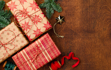 Christmas New Years background with gift boxes on a wooden table.  Copy space