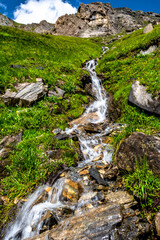Mountain Creek With Freshwater Waterfall In National Park Hohe Tauern In Tirol In Austria