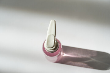 Luxury Cosmetic Branding – Small Bottle in Soft-Colored Liquid