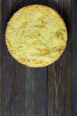 Top view of homemade royal cheesecake on oak wooden table, copy space, rustic