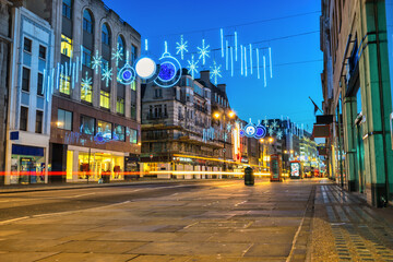Christmas lights illuminating Strand road in central London. England