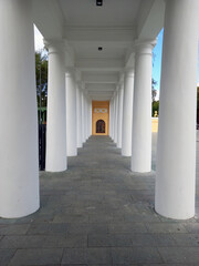 An architectural structure with white columns.