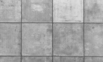 Gray concrete wall with lots of concrete shapes and grid lines