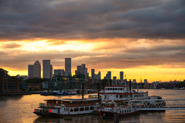 London skyline of river Thames overlooking Canary Wharf at sunrise. England
