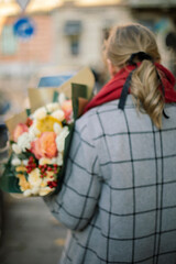 A white hair girl with a bouquet from the back