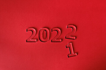 Fototapeta na wymiar Minimalistic design concept for the shift from 2021 to 2022. Top view.