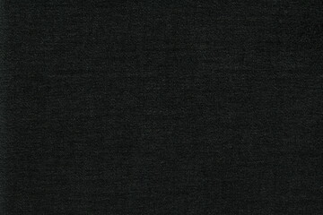 Naklejka na ściany i meble The texture of a rough very dark natural fabric. Abstract rough background of natural material.
