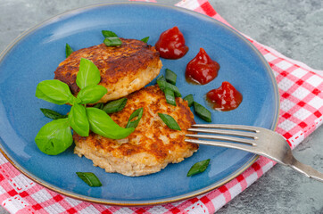 Blue plate with two minced meat cutlets. Studio Photo