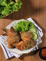 Bandeng Presto Juwana, Milkfish Cooked with Pressure Cooker, Served with Chilli Paste (Sambal) and Fresh Vegetable