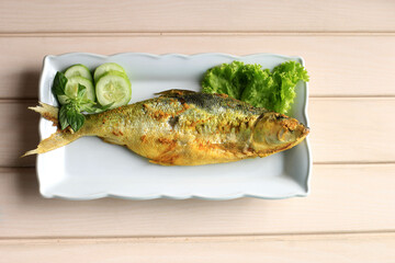 Raw Bandeng Presto Juwana, Milkfish Cooked with Pressure Cooker, Served with Chilli Paste (Sambal) and Fresh Vegetable, Copy Space for Text