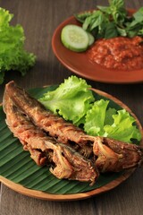 Selected Focus Lele Goreng or Fried Catfish is Traditional Indonesian Culinary Food. Catfish and Chilli Tomato Paste, Popular Street Food Called Pecel Lele Lamongan