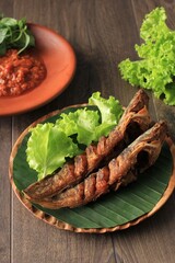 Lele Goreng Penyetan or Fried Catfish is Traditional Indonesian Culinary Food. Catfish and Chilli Tomato Paste, Popular Street Food Called Pecel Lele Lamongan