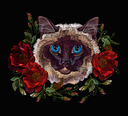 Siamese cat and ring from red roses flowers. Beautiful kitty and and floral garden. Classical embroidery in black background. Fashionable romantic template for clothes, t-shirt design