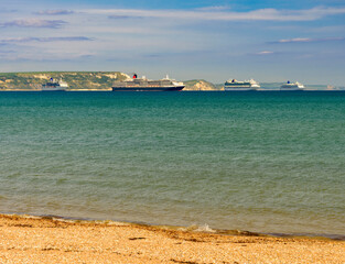 Weymouth beach with cruise liners moored in the bay