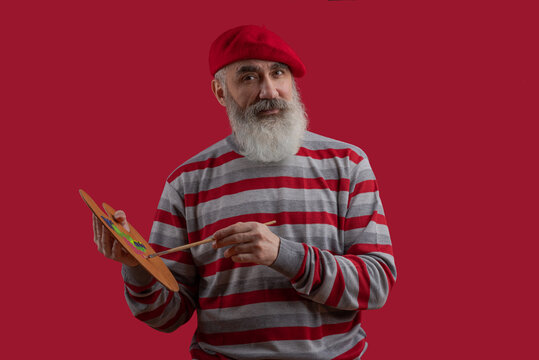 Adult handsome senior male model wearing striped sweater