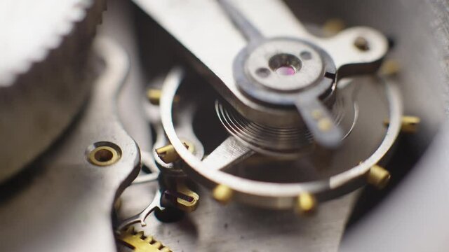 Old vintage clock mechanism working, macro shot with slow motion