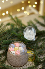 hot cocoa with marshmallow in christmas decoration