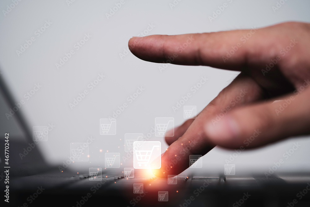 Aufkleber businessman using computer laptop with shopping trolley cart icon for input and send order for onlin