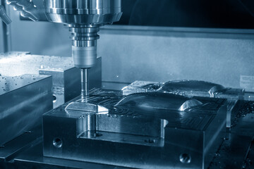 The CNC milling machine rough cutting the injection mold parts by indexable  endmill tools.