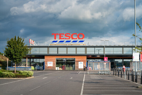 Bicester,England-August 2021:Tesco supermarket sign atop a store exterior at Bicester town