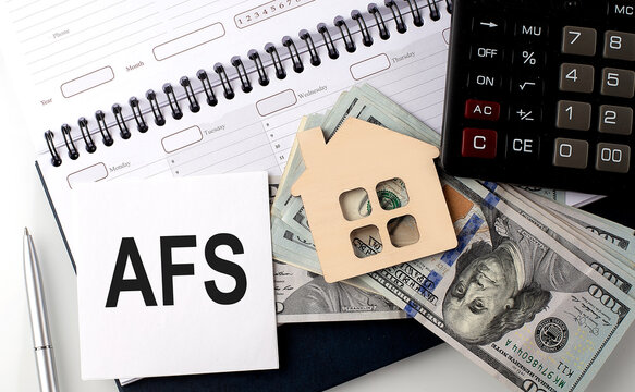 AFS - the inscription of text on the sticker on planning with dollars and calculator
