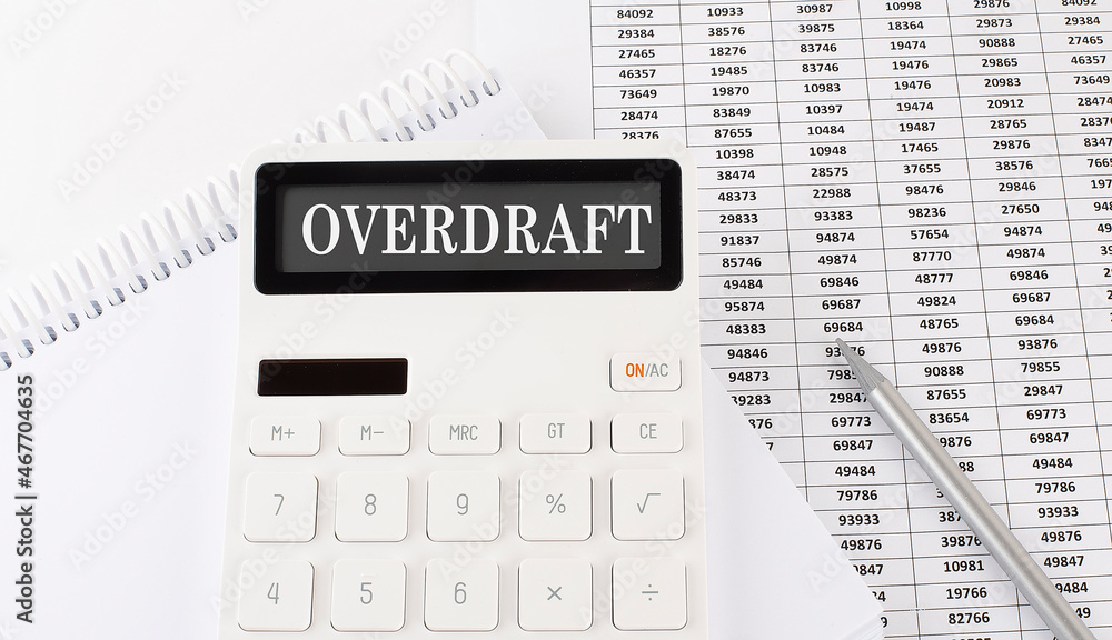 Poster calculator with text overdraft on the notebook . business, finance conceptual.