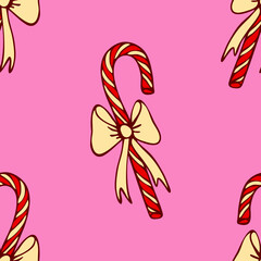 Seamless vector pattern with Christmas candy cane on pink background. Simple winter festive wallpaper design. Decorative lollipop fashion textile.