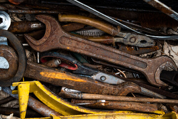 old rusty tools on wood background