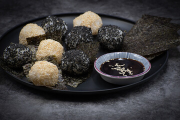 Japanese rice balls with white and black sesame seeds