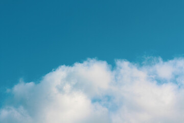 Blue peaceful Sky with fluffy clouds wallpaper. Idea for backdrop design