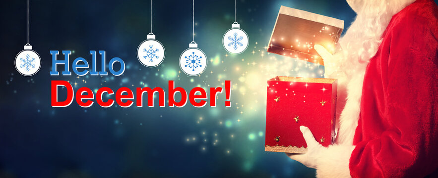 Hello December message with Santa opening a gift box on a shiny light background