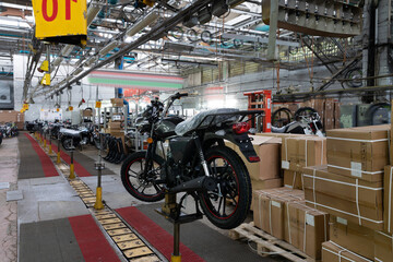 Fototapeta na wymiar motorcycle factory, assembly line of motorcycles and scooters