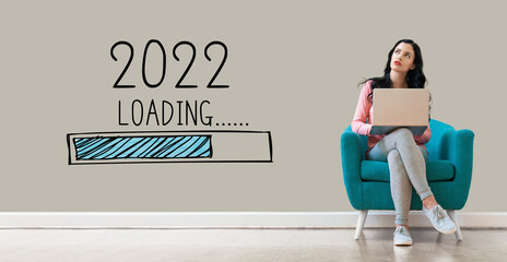 Loading new year 2022 with young woman using a laptop computer
