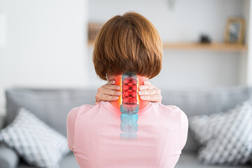 Intervertebral hernia of the cervical spine, neck pain, woman suffering from backache at home,...