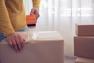 Close-up of packing a box.