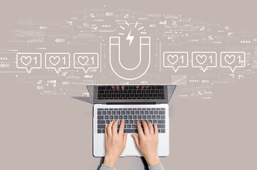 Get more likes concept with person using a laptop computer