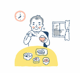 笑顔で朝食を食べるシニア男性