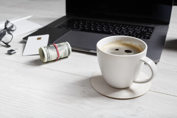 Coffee pause concept. Coffee cup, money and credit card. Selective focus.