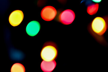 Abstract of Random Colorful Round Lights on a Black Background