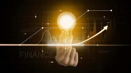 The person holding an orange light bulb, graphic charts and fluctuations in financial data, showing business growth. Business strategy. Digital marketing. digital business hologram.