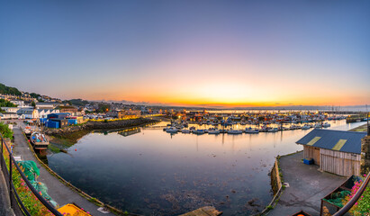 Newlyn town harbour panorama at sunrise in Cornwall. United Kingdom