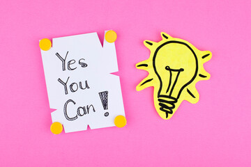 Motivational quote text yes you can with light bulb