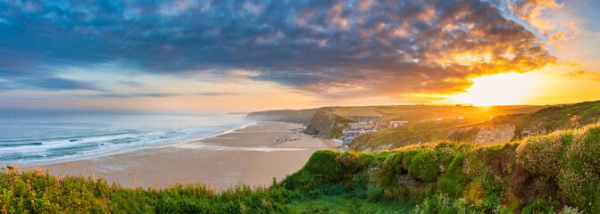 Watergate Beach panorama at sunrise in Cornwall. UK