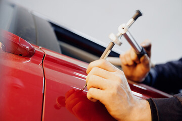 Car body repair, removal of dents paintless with knock tool